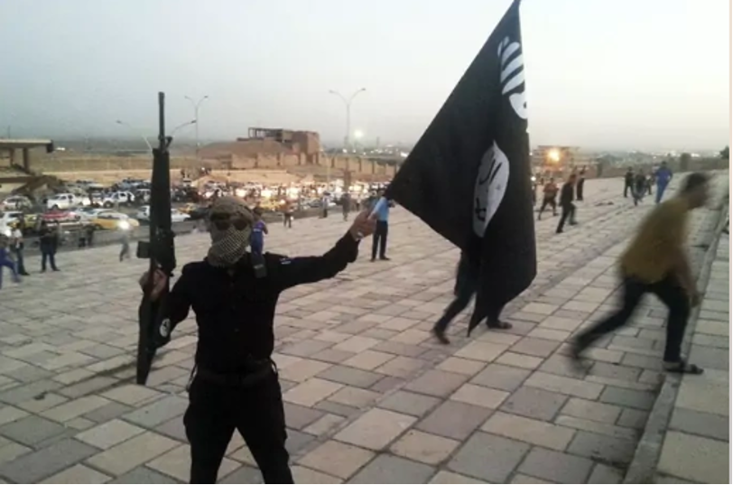 The figure illustrate an Islamic state fighter during the rise of ISIS in 2014.
