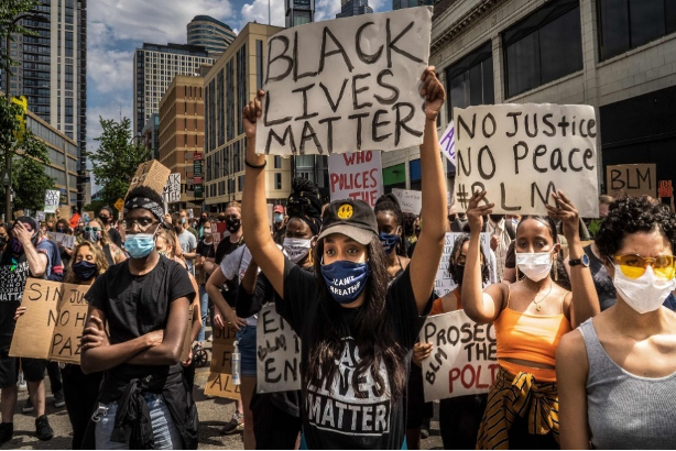 Black Lives Matter protest image-symbolizing the contemporary fight against systemic racism (Axios, 2020)