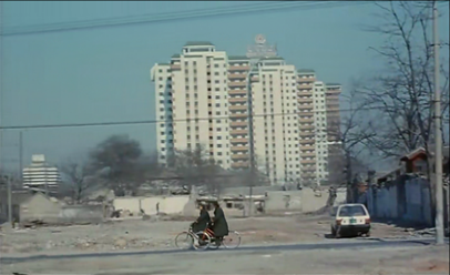 Police ride through the residential area